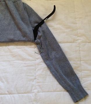 How to hang a sweater on a hanger - Step 3